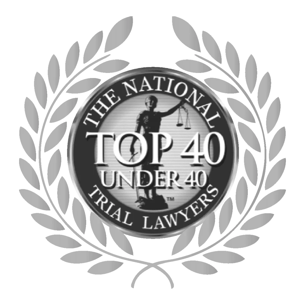 A silver emblem featuring Lady Justice for the Top 40 Under 40 Trial Lawyers award
